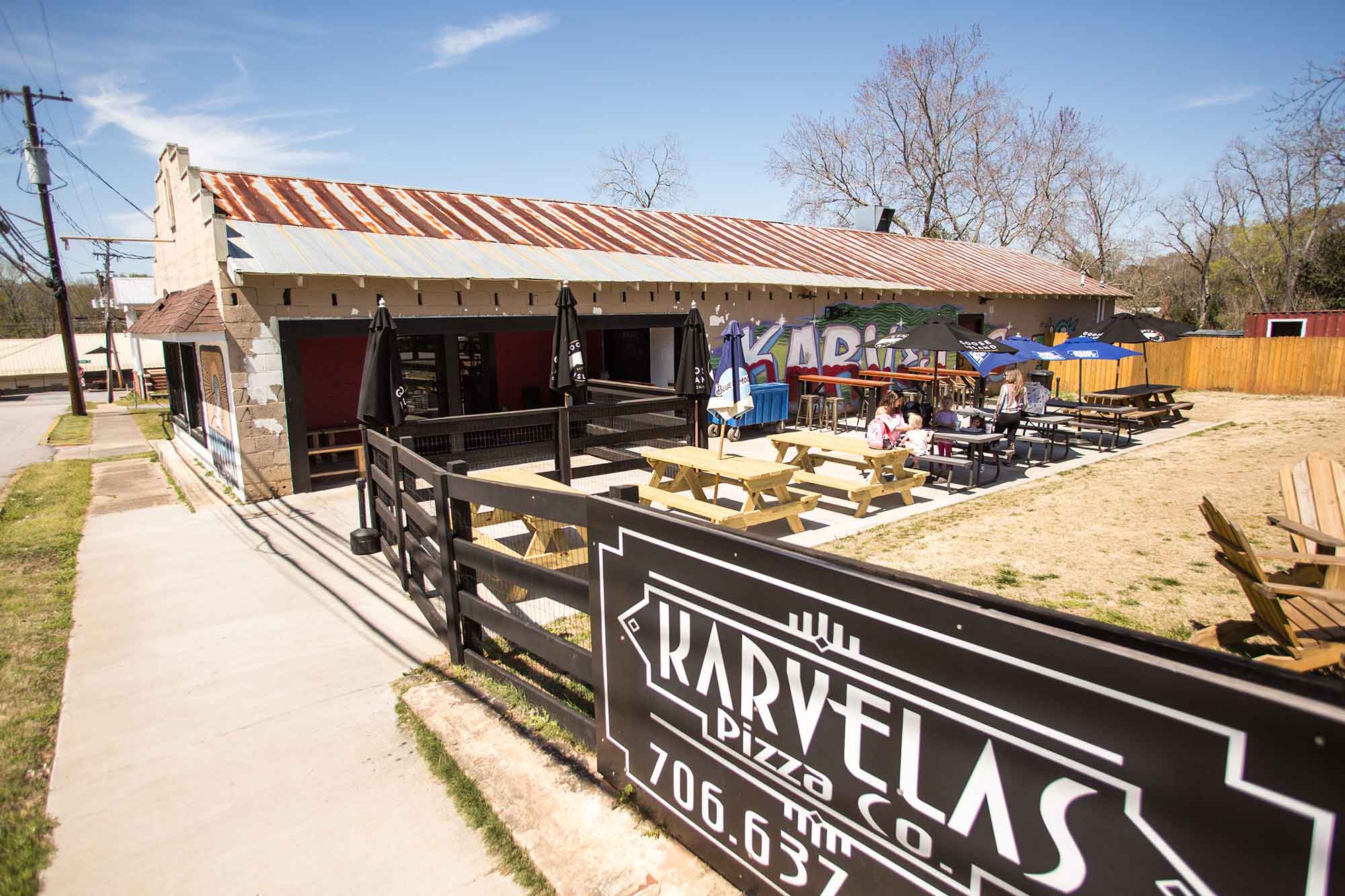 Karvelas-Pizza-Co.-outdoor-eating-family
