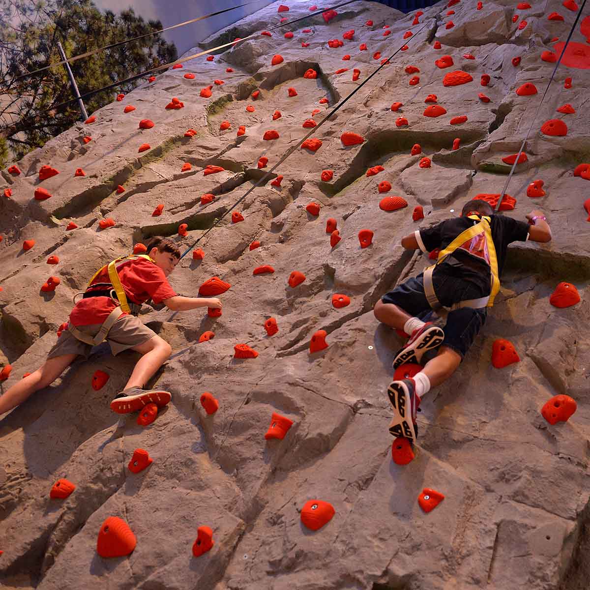 Two guests enjoy rock climbing at Great Wolf Lodge in LaGrange, Georgia.