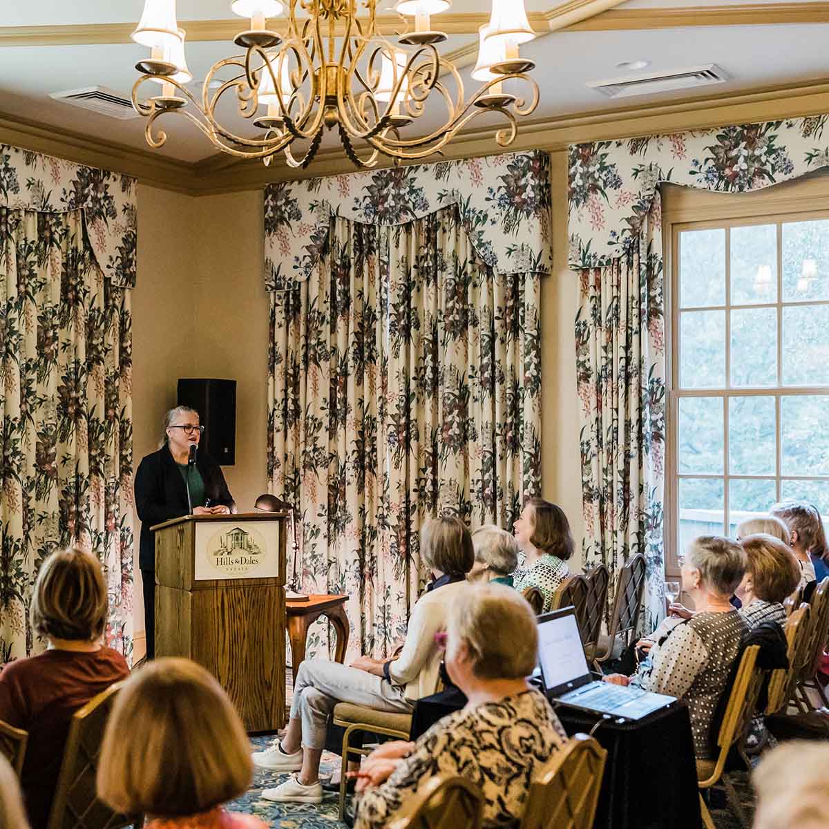 A speaker presents during an event in the Hills & Dales Estate visitor center.