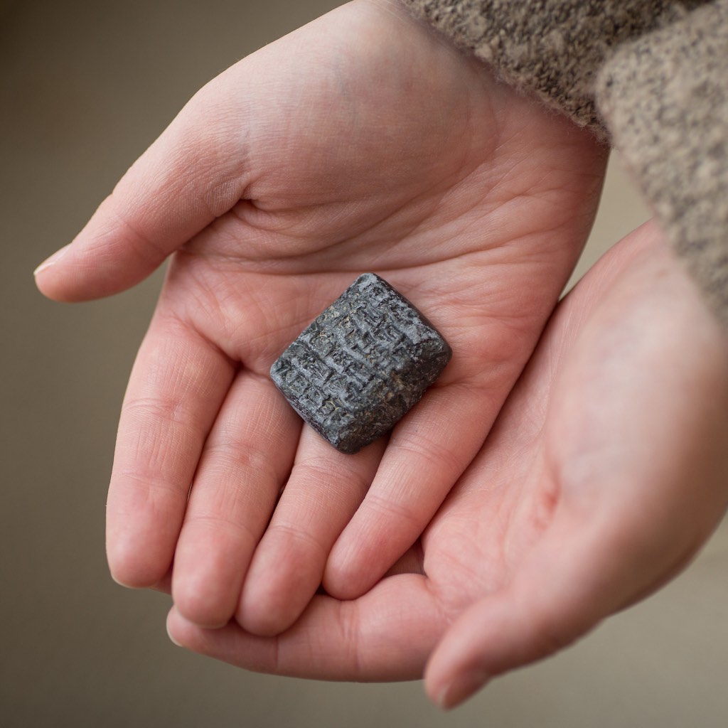 legacy-museum-on-main-1x1-hands-holding-exhibit-piece