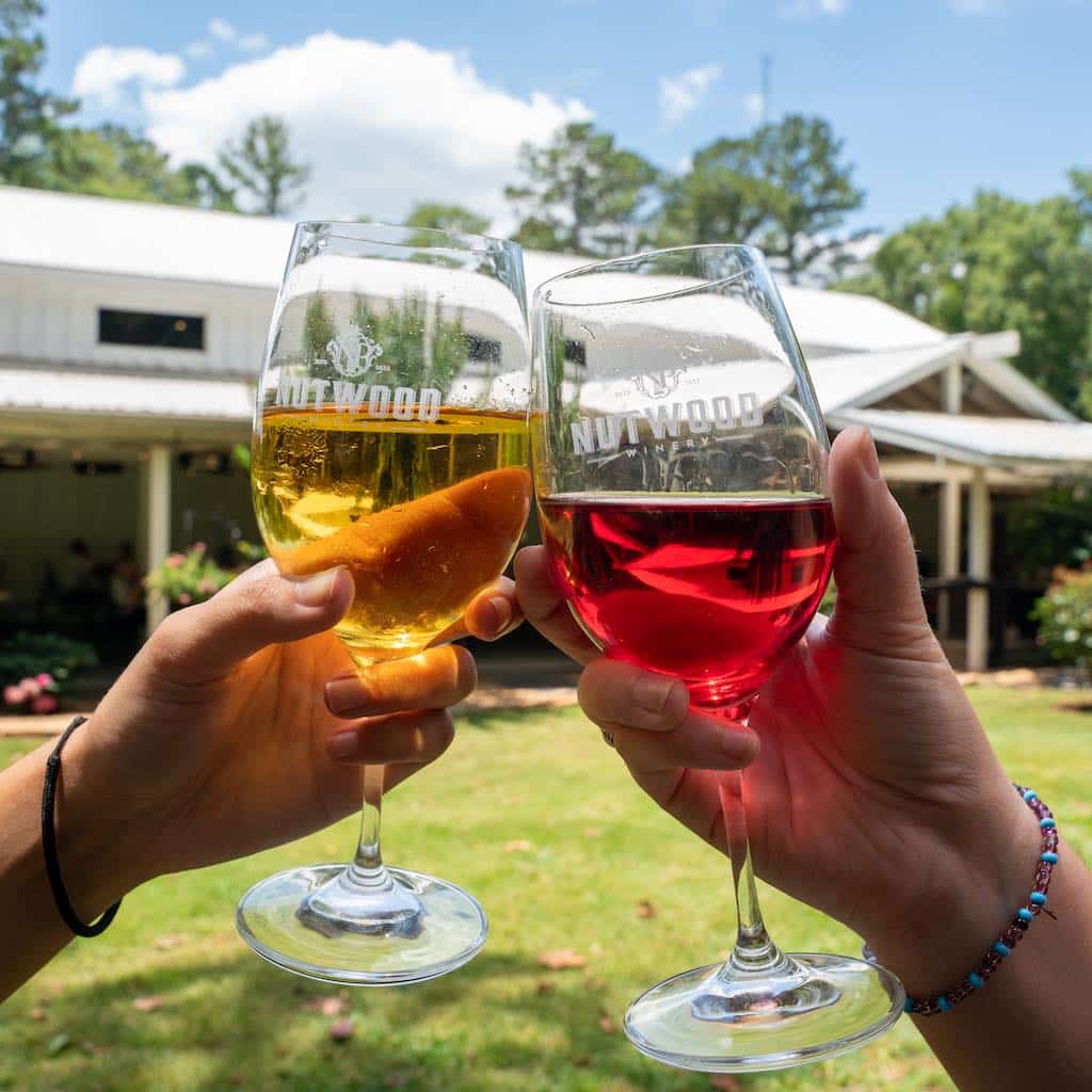 nutwood-winery-wine-glasses-clinking-visit-lagrange