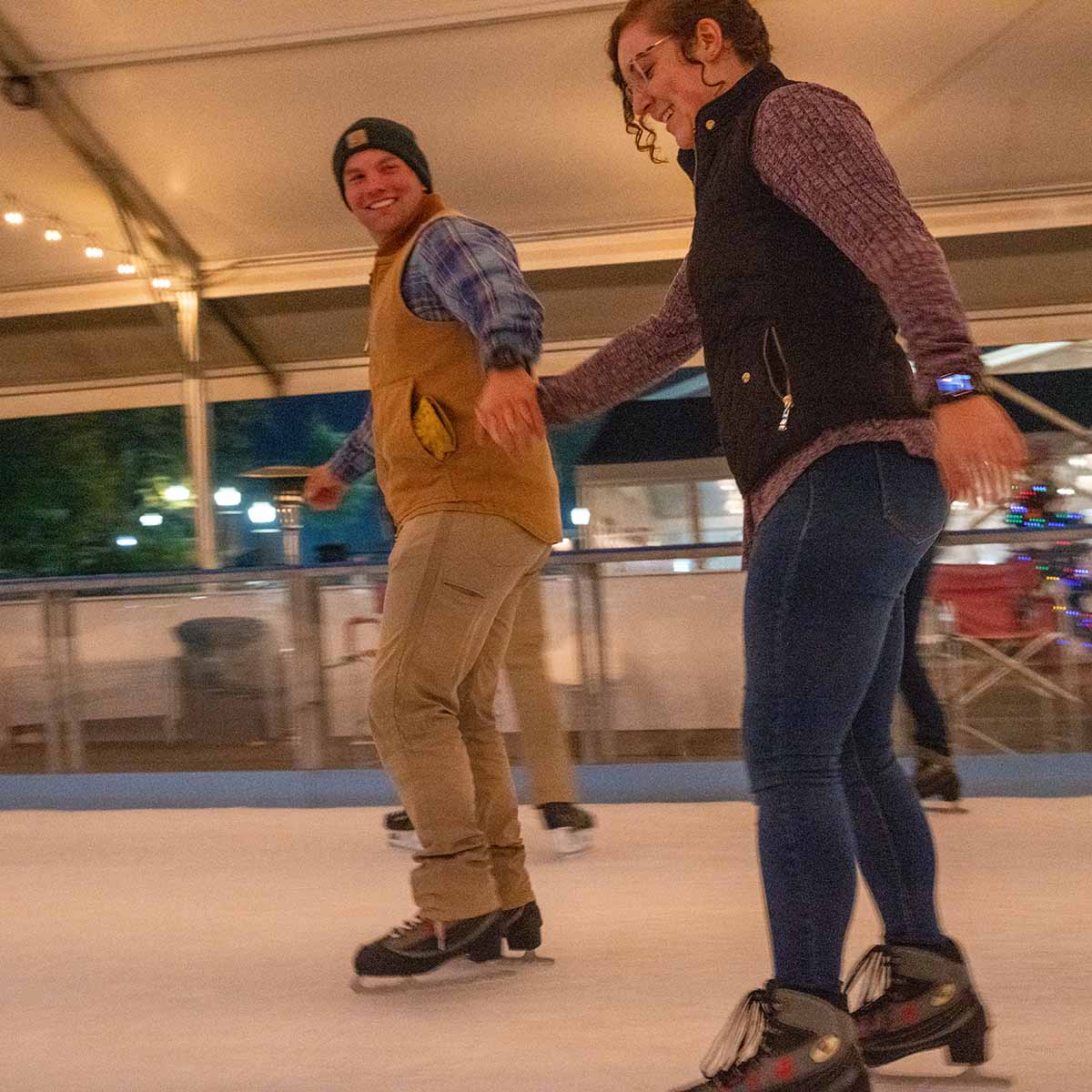 A couple enjoys ice skating at Sweetland on Ice in LaGrange, Georgia.